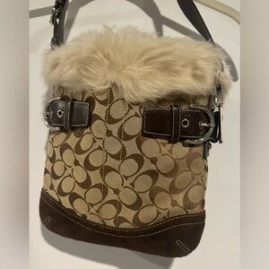 Coach signature C canvas and leather shoulder bag with lamb shearling trim